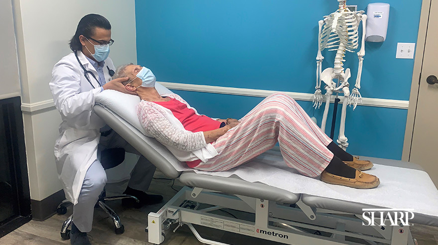 Dr. Patricio Guaiquil treats a patient at Sharp HealthCare